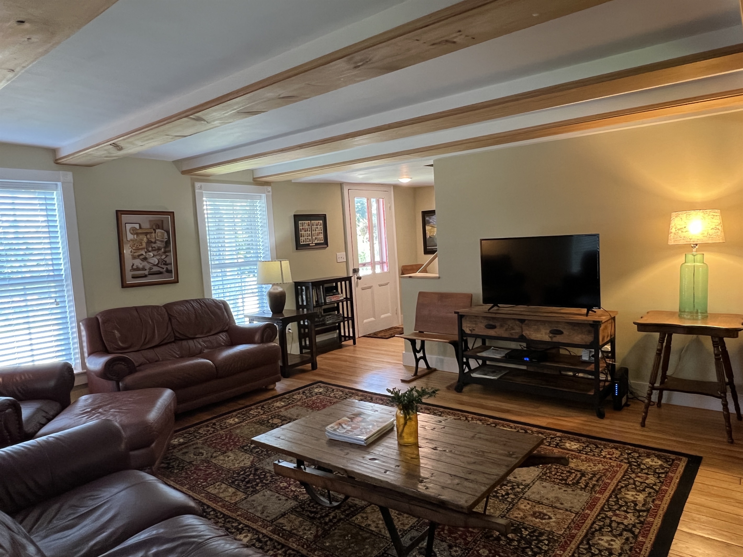 Living Room with leather furniture and a smart TV.