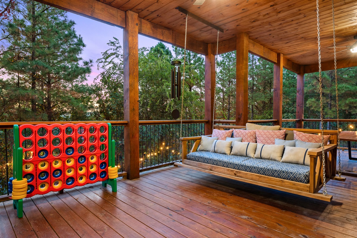 Rain or shine, this covered porch with oversized Connect 4 is the perfect spot for some family fun or relaxation.