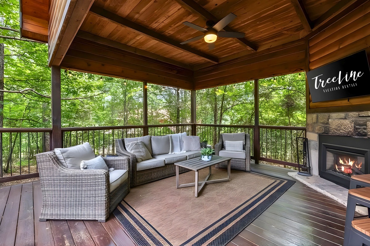 Out here, covered seating and an outdoor fireplace make relaxing easy.