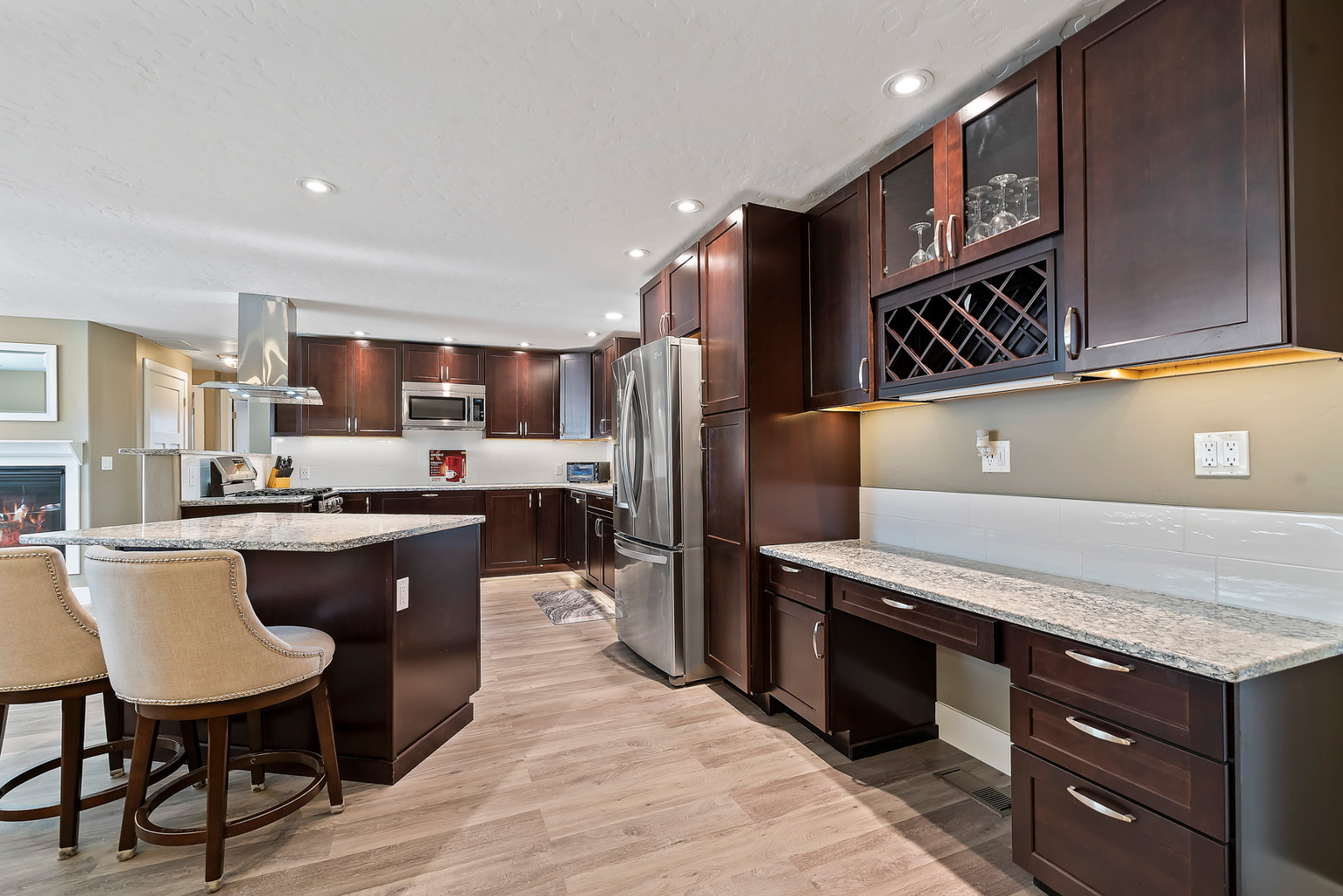Upgraded kitchen with a built-in desk space perfect for working or gaming, complemented by overhead lighting for a bright and comfortable setting.