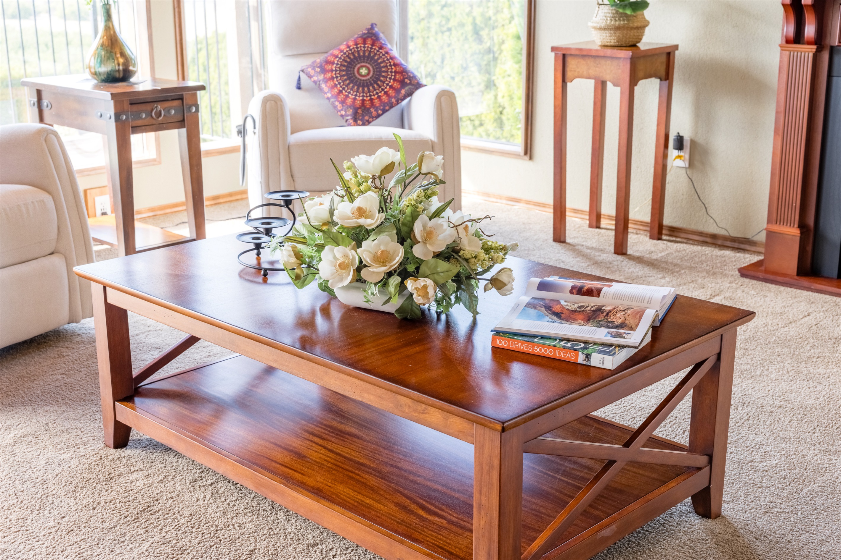Cozy seating with serene river and mountain views.