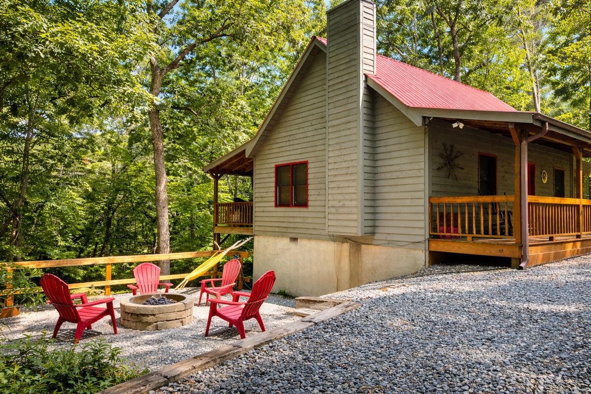 Cabin days, firepit nights - Relax under the trees with cozy Adirondack chairs and peaceful mountain air all around.