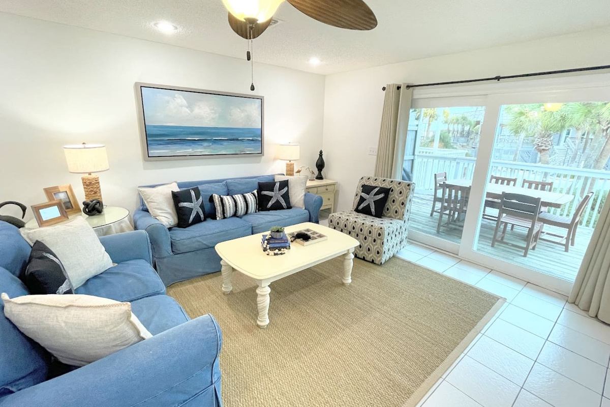 Step from the living room straight onto the back deck &mdash; one step and you are in the Gulf breeze.
