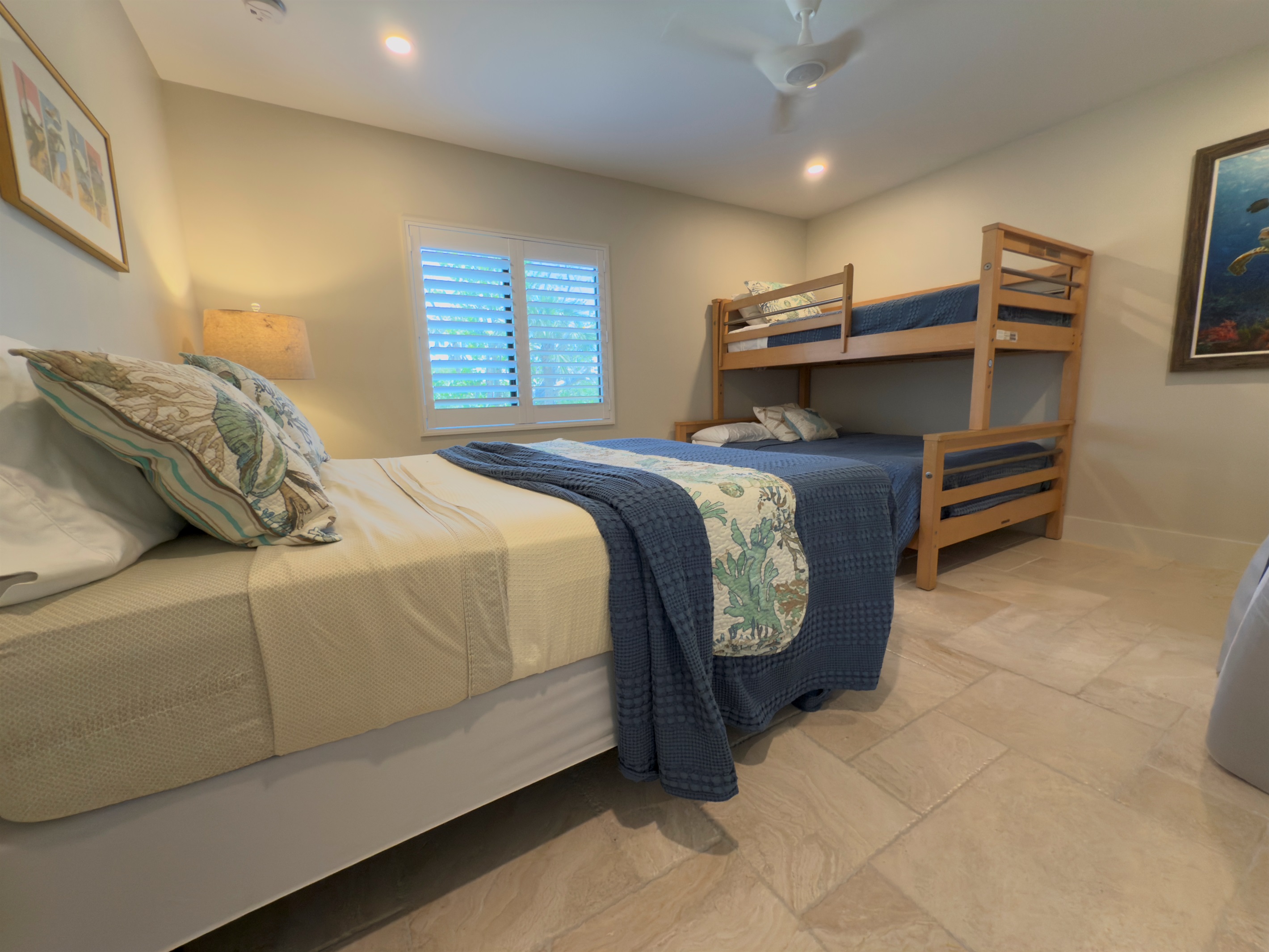 Guest bedroom with a queen and twin over full bunkbed