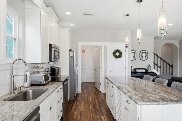 Well-appointed kitchen with modern appliances, generous storage and convenient breakfast seating.