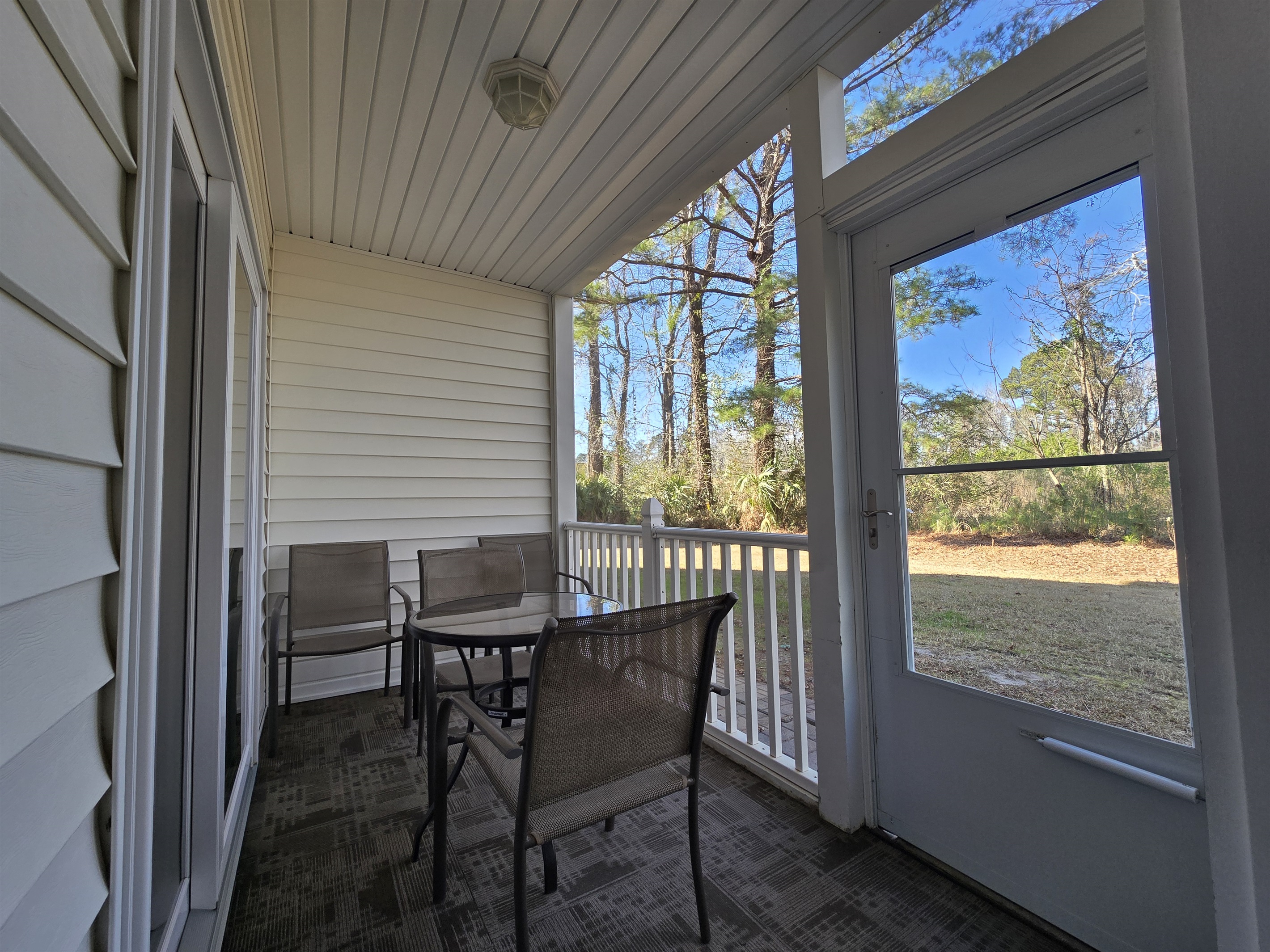 Private, screened in Patio with backyard access
