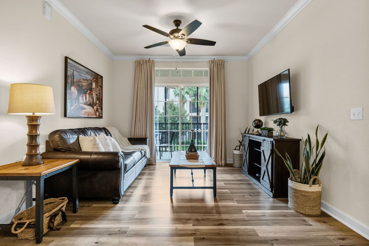 Spacious and well-lit living area, complete with a TV for enjoying your favorite shows or movies.