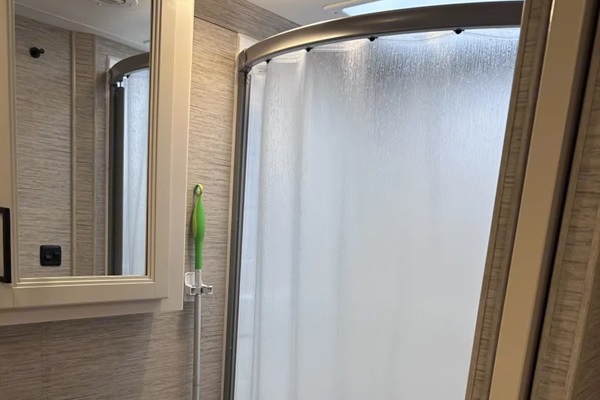 Oversized RV shower with curtain shut