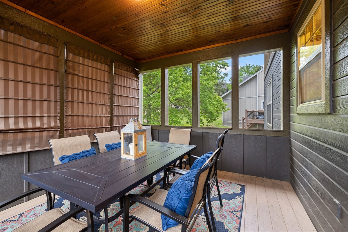 Main level screened in deck with shades for privacy