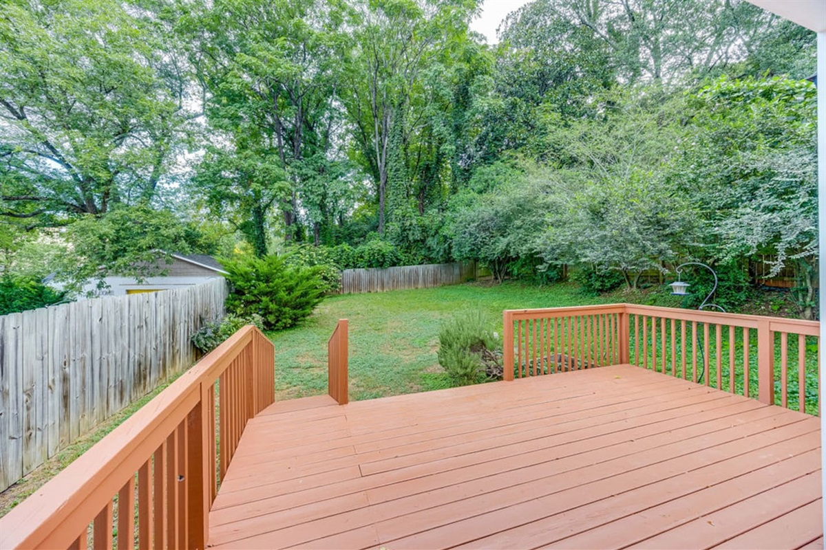 Peaceful backyard with a scenic view of nature, offering a tranquil space to relax and unwind outdoors.