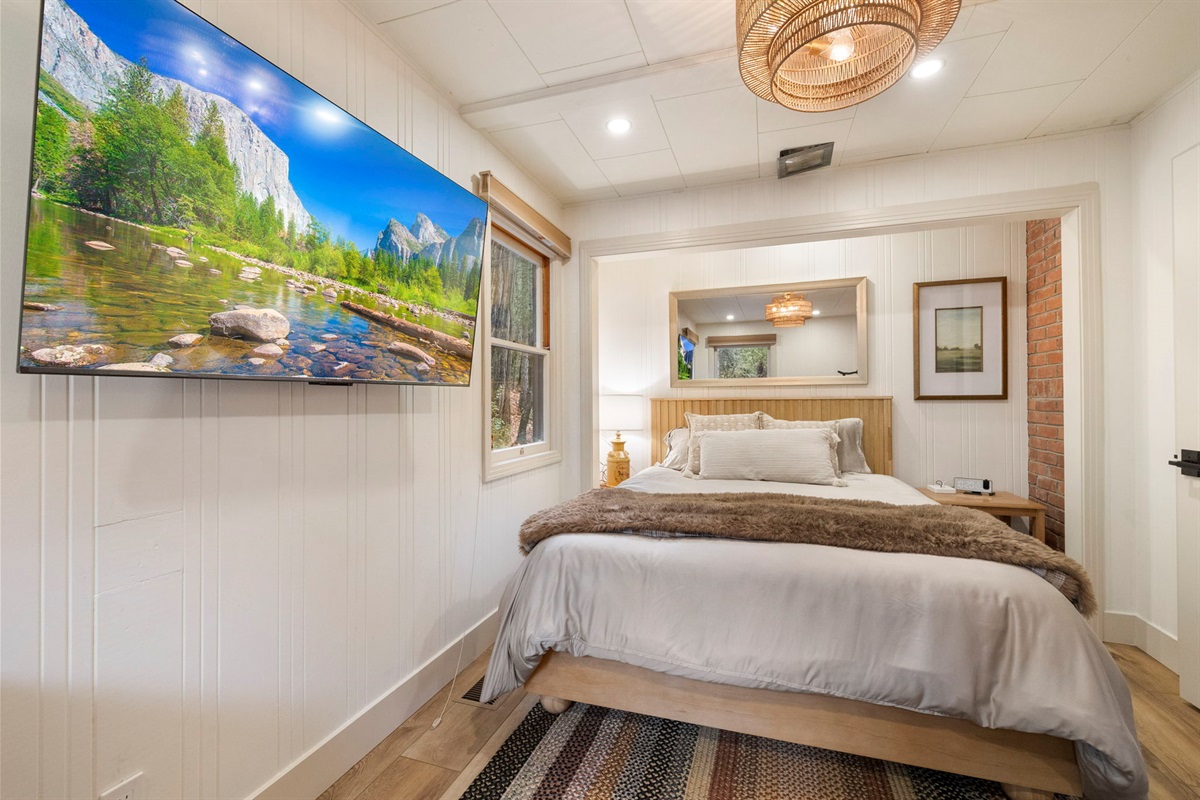 Serene master bedroom with a new memory foam queen mattress. It also includes a separate work/relax area within the room. A smart TV with a HDMI cable and hookups is included as well.