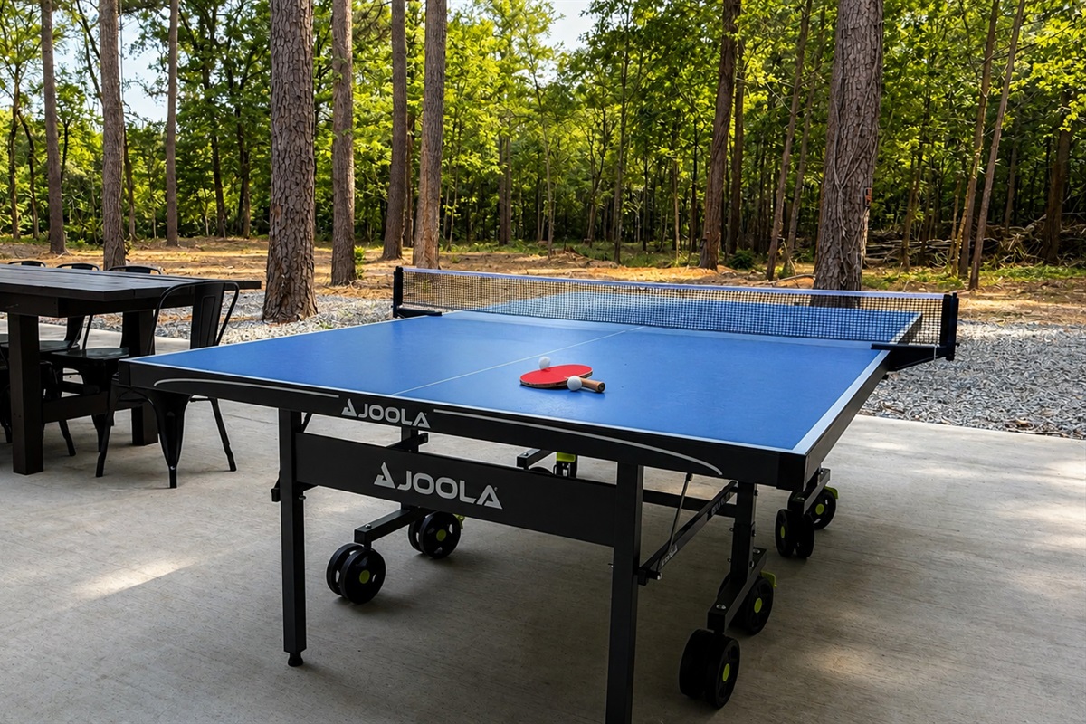 Outdoor Game Area: Enjoy friendly competition with our ping pong table in the serene woods!