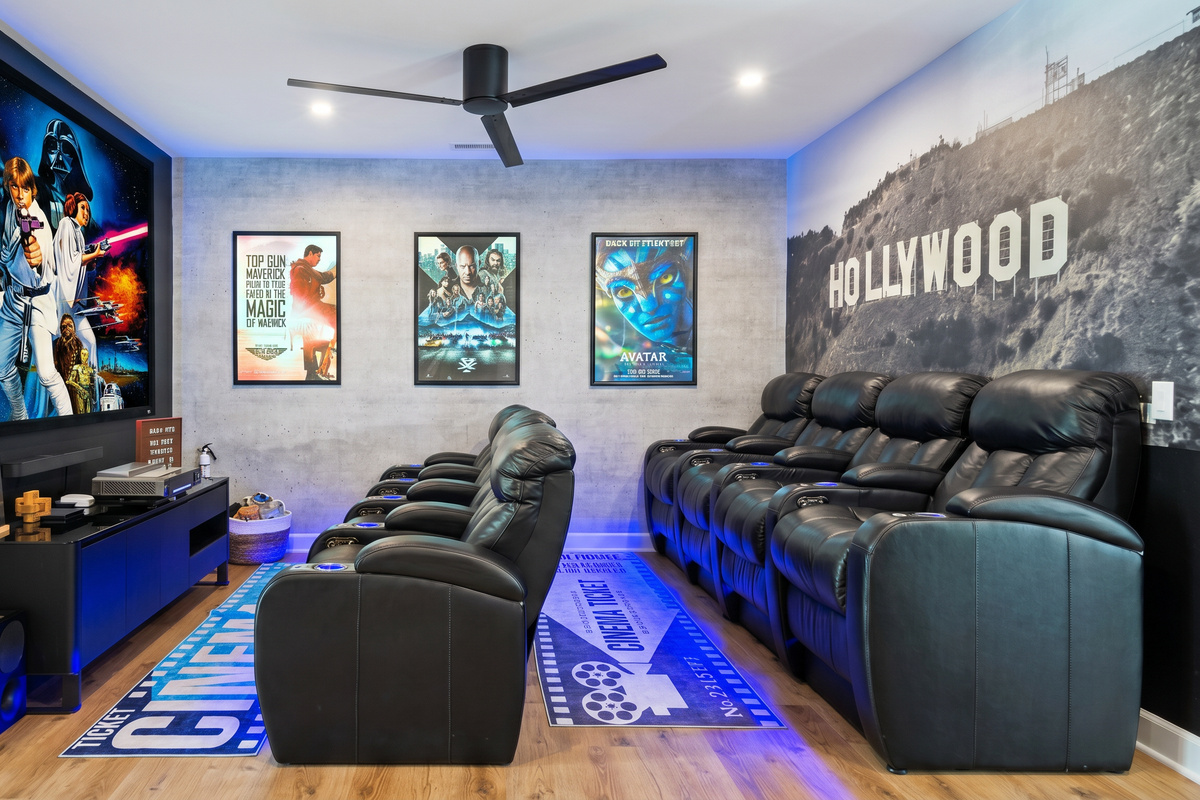 The movie room has eight leather recliners. 