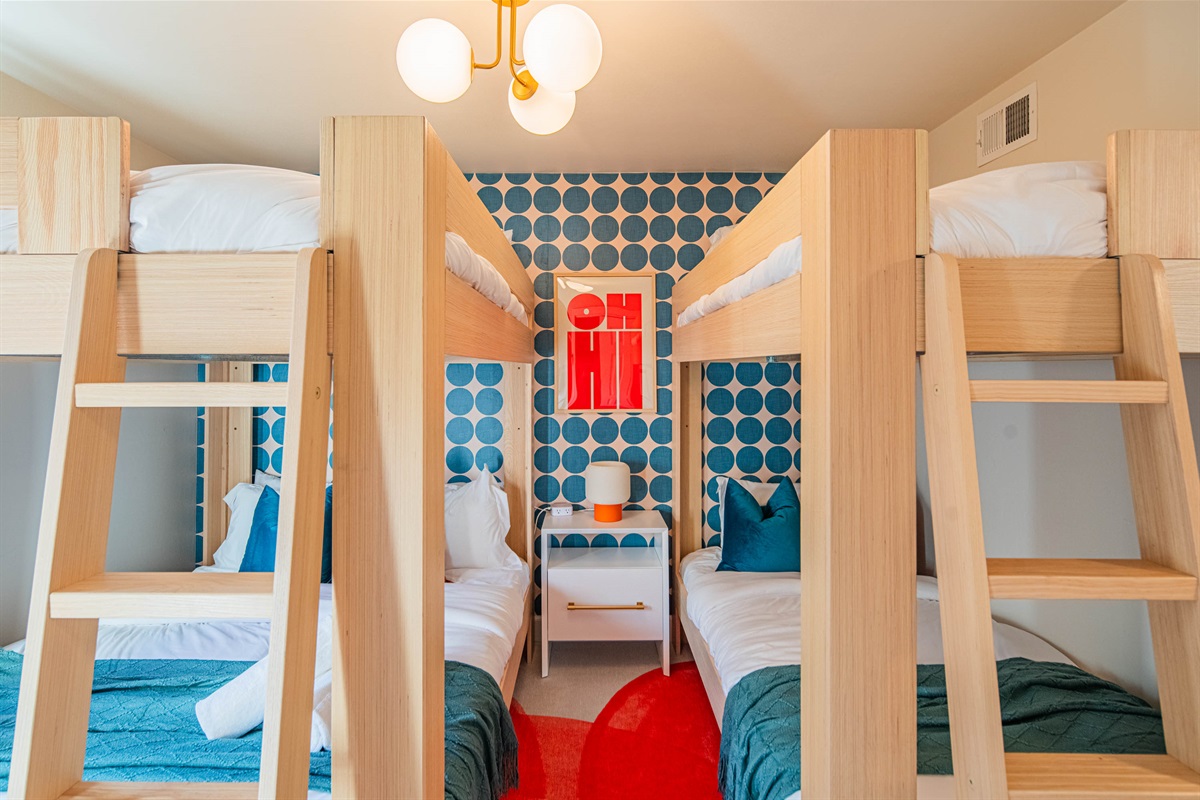 Fun and functional bunk room with multiple beds — ideal for kids, teens, or group trips looking to maximize sleeping space.