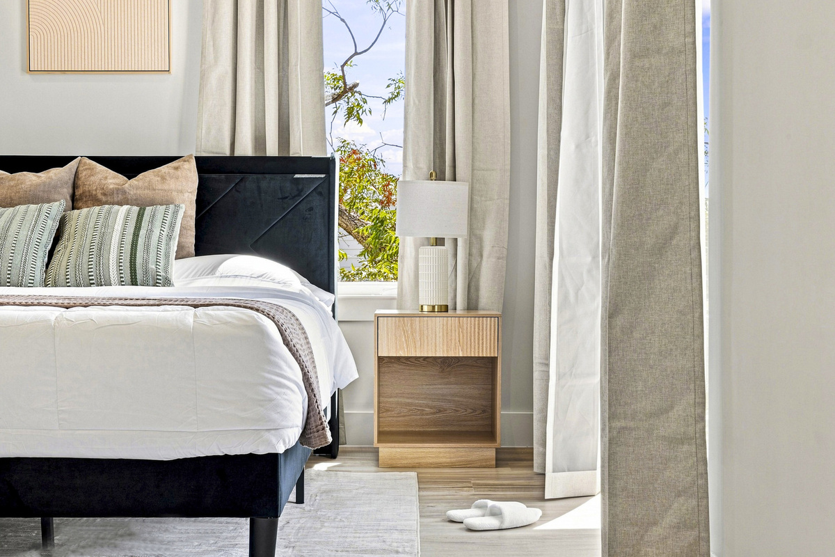 Light-filled space with plush bedding, stylish decor, and warm, inviting vibes!