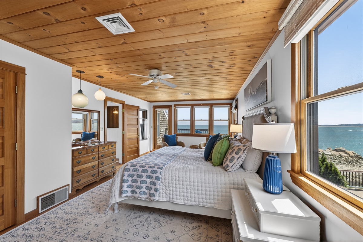 Wake up to ocean views in this bright, relaxing bedroom with deck access. 🌊