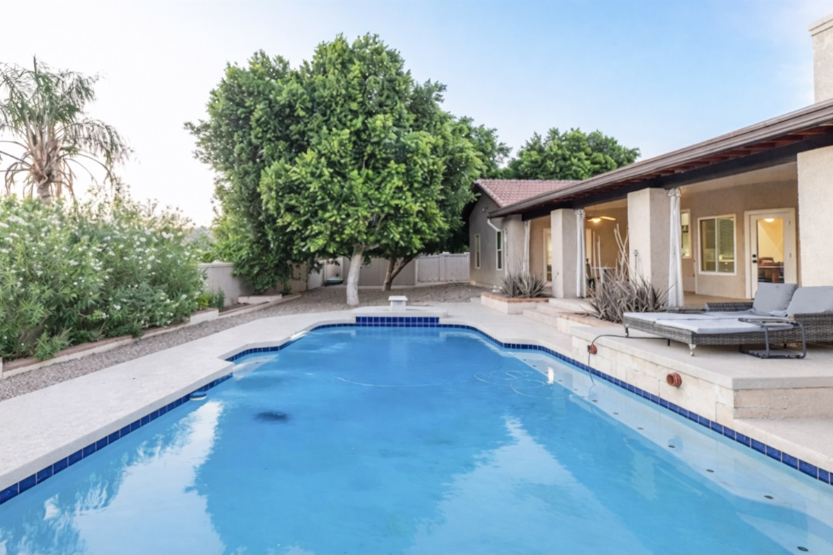 Take a soothing dip in the heated pool surrounded by lush greenery and serene outdoor lounge areas.