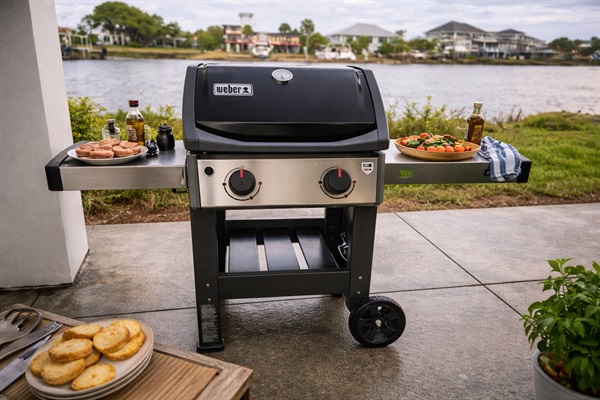 Weber gas grill ready for backyard BBQ season and outdoor cooking.