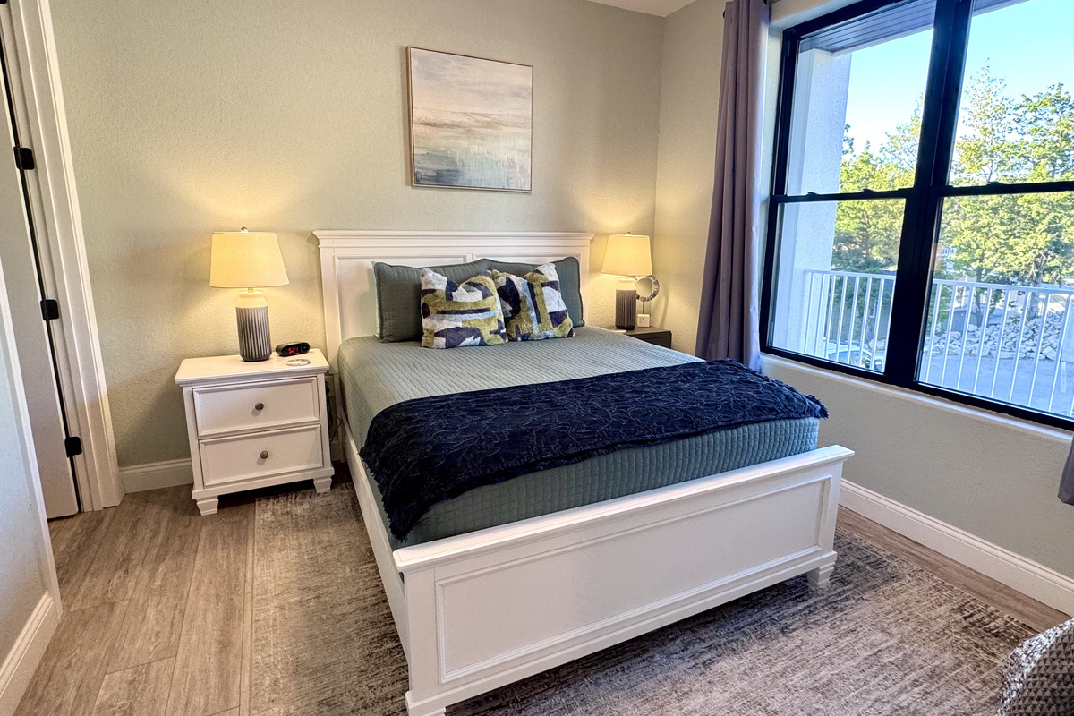 Bedroom 3 has a comfy queen bed, RokuTV, closet, two nightstands, table lamps, a dresser, an alarm clock, all bedding linens, extra pillows, a blanket, and an extra set of sheets.