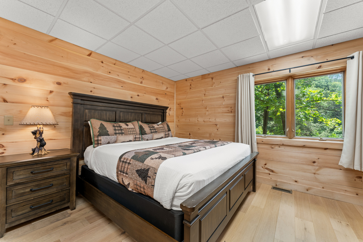 Bedroom #4 is located on the lower level and has a king size bed and 50" smart TV with cable.
