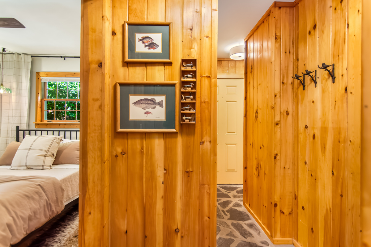 Hallway area that leads to laundry closet, linen closet, and second bathroom.