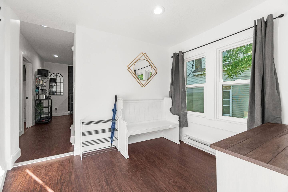 Bright and inviting entryway with stylish decor and plenty of natural light. The perfect space to kick off your shoes and relax during your stay!