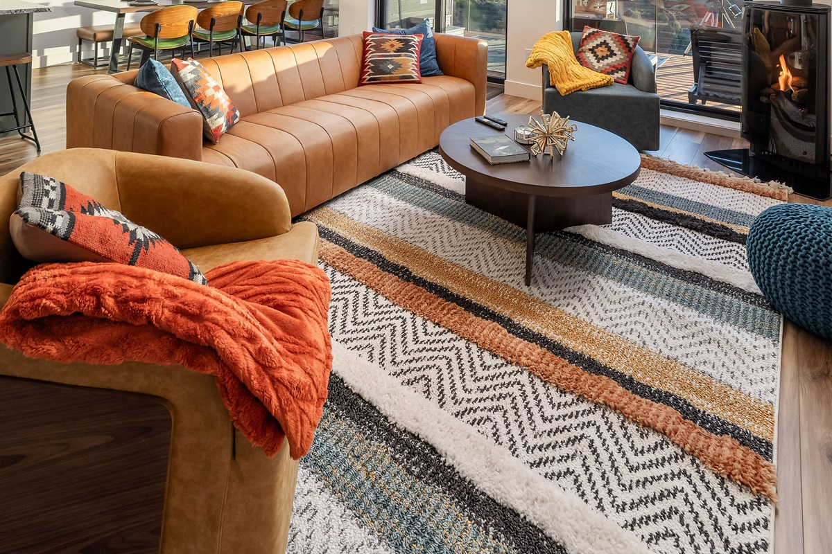 Swivel Chairs and a Sofa to Get Cozy By The Fireplace