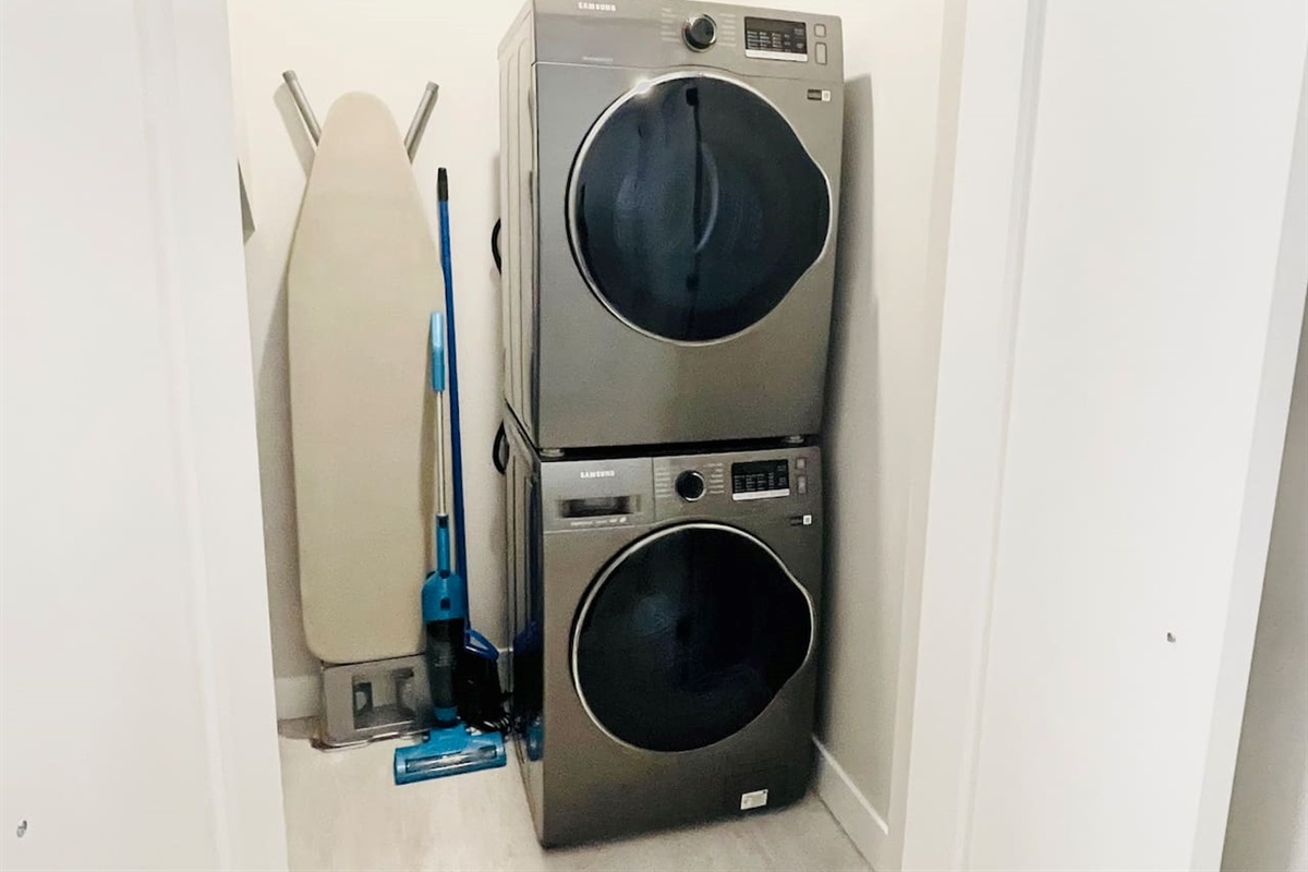 Brand new Samsung, Stackable Washer and Dryer. Also, ironing board and vacuum kept in Laundry Area. 