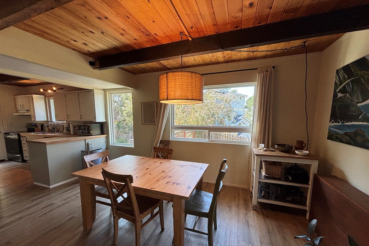Dining area, kitchen on left