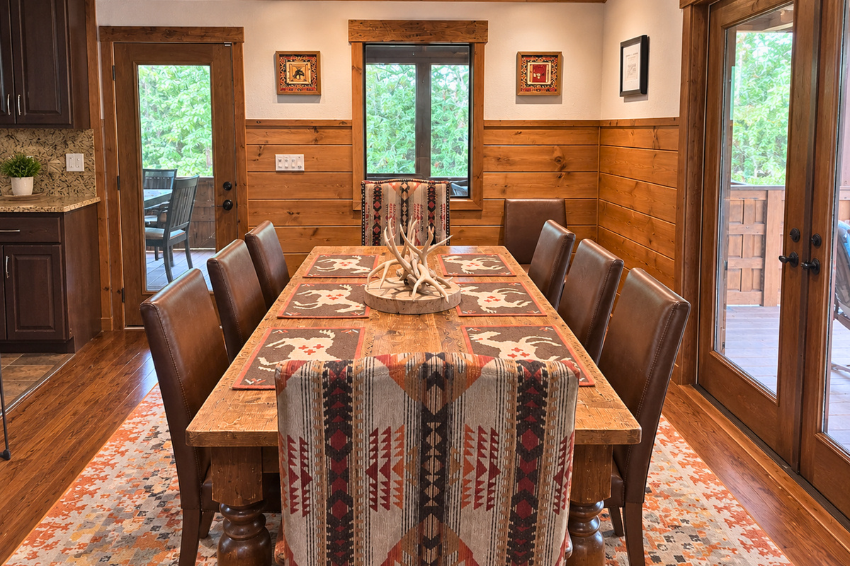 Gather around the long dining table for family meals, morning coffee, or a laid-back game night with plenty of seating for the whole group.