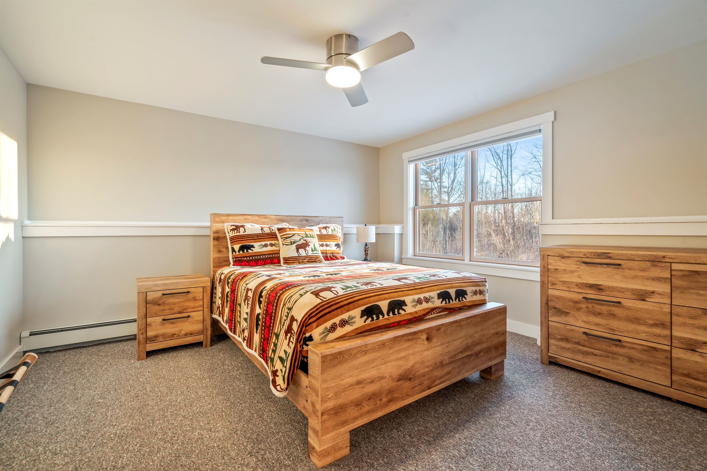 Relax in the basement bedroom with a cozy queen bed and added privacy.