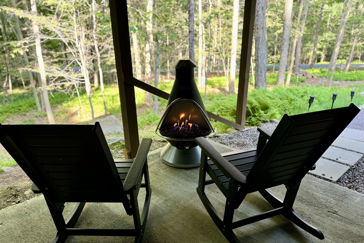 “Forest lounge with modern fire feature — unwind, sip, repeat.”