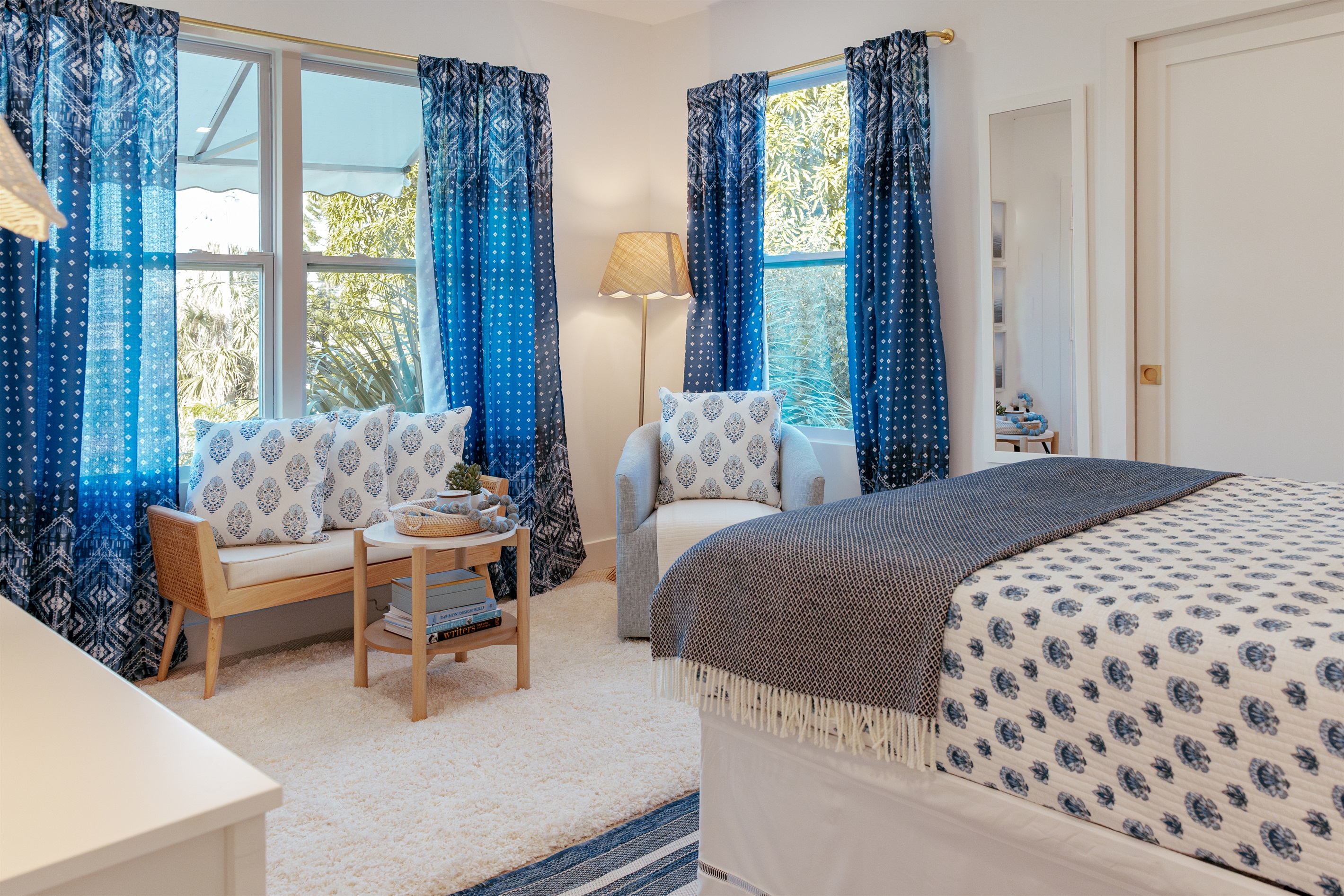 The second bedroom is next to the main bedroom, continuing the them of high design with a bonus additional seating area with plenty of space.