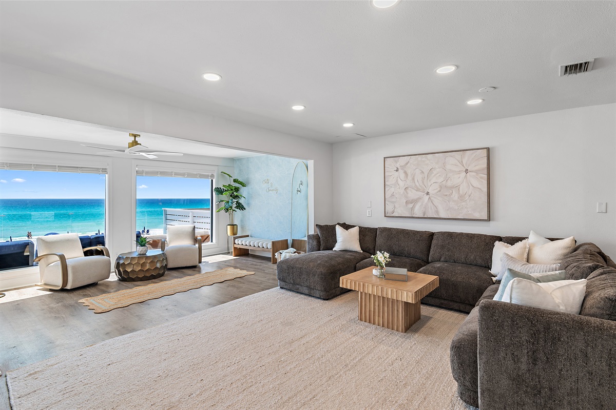 Green Reef 1 has a Stunning Living Room with huge comfortable sectional, Gulf views, Smart TV, Nintendo Switch, Electric Fireplace, and more!