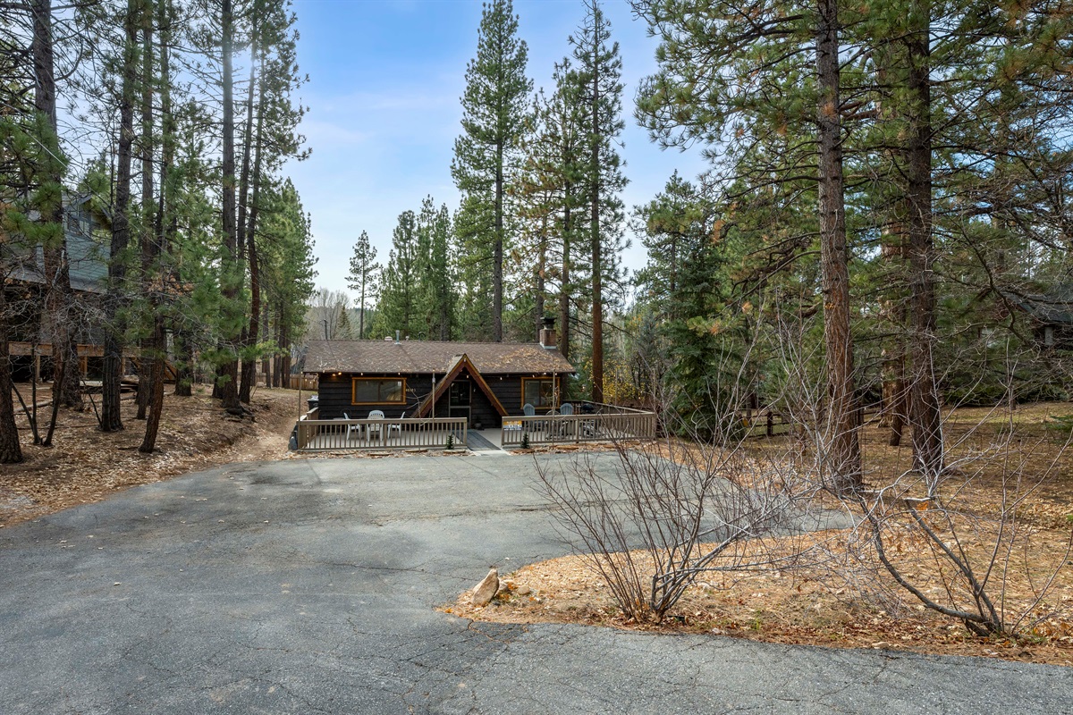 A large driveway offers ample parking. Easy to get in and out of the driveway. A second smaller parking area is at street level.