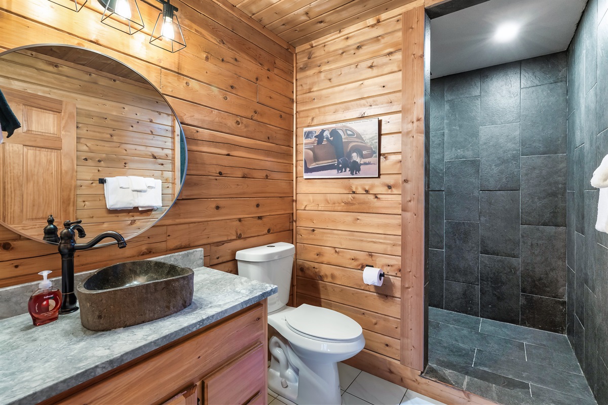 Main floor shared bathroom with rainshower