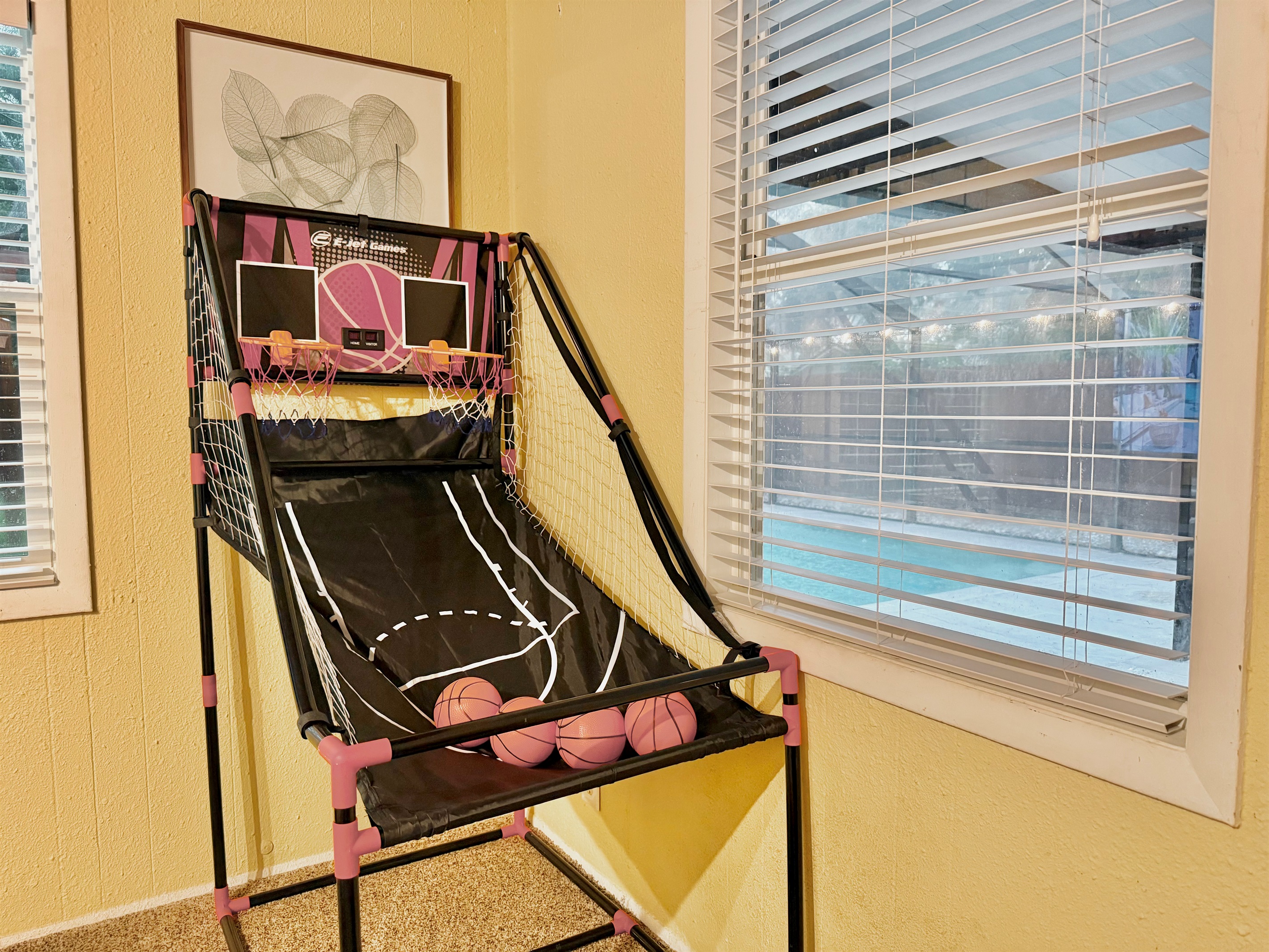 Enjoy endless fun with a basketball shootout game, cozy carpeted floors, and a smart TV setup—ideal for game nights or Saturday cartoons.