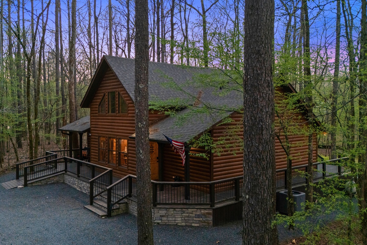 Pulling up to the property, you’re greeted by a warm and inviting exterior that feels both private and welcoming.