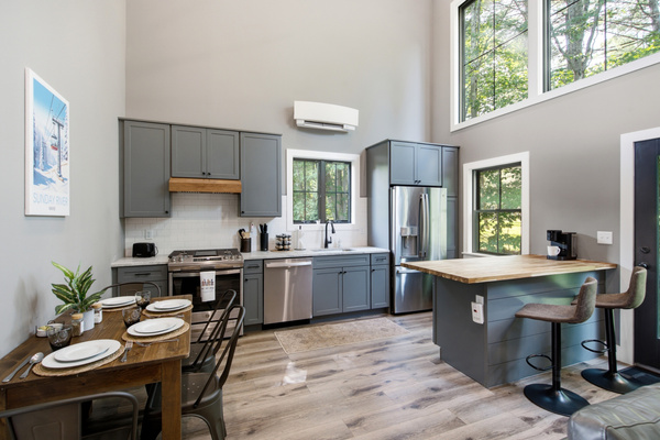 Modern finishes, generous workspace, and natural light make meal preparation simple and enjoyable.