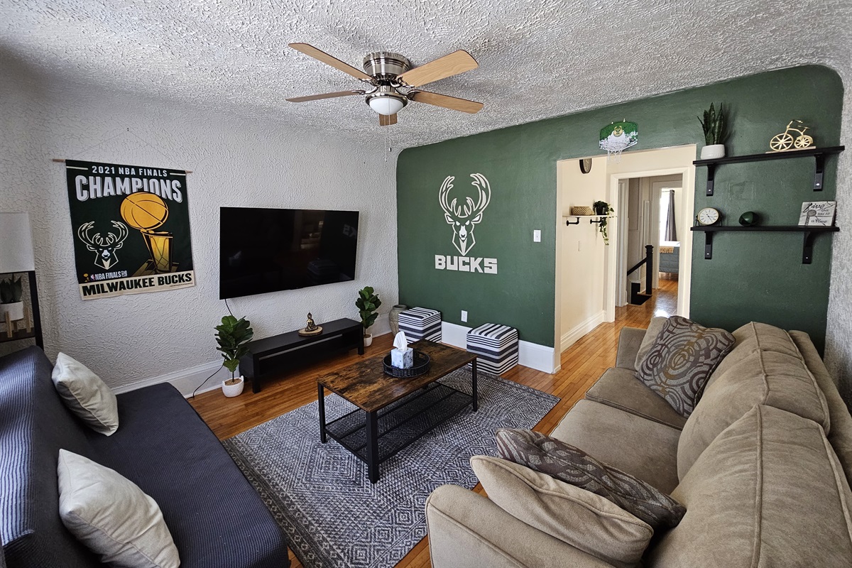 Cozy livingroom with custom Bucks mural