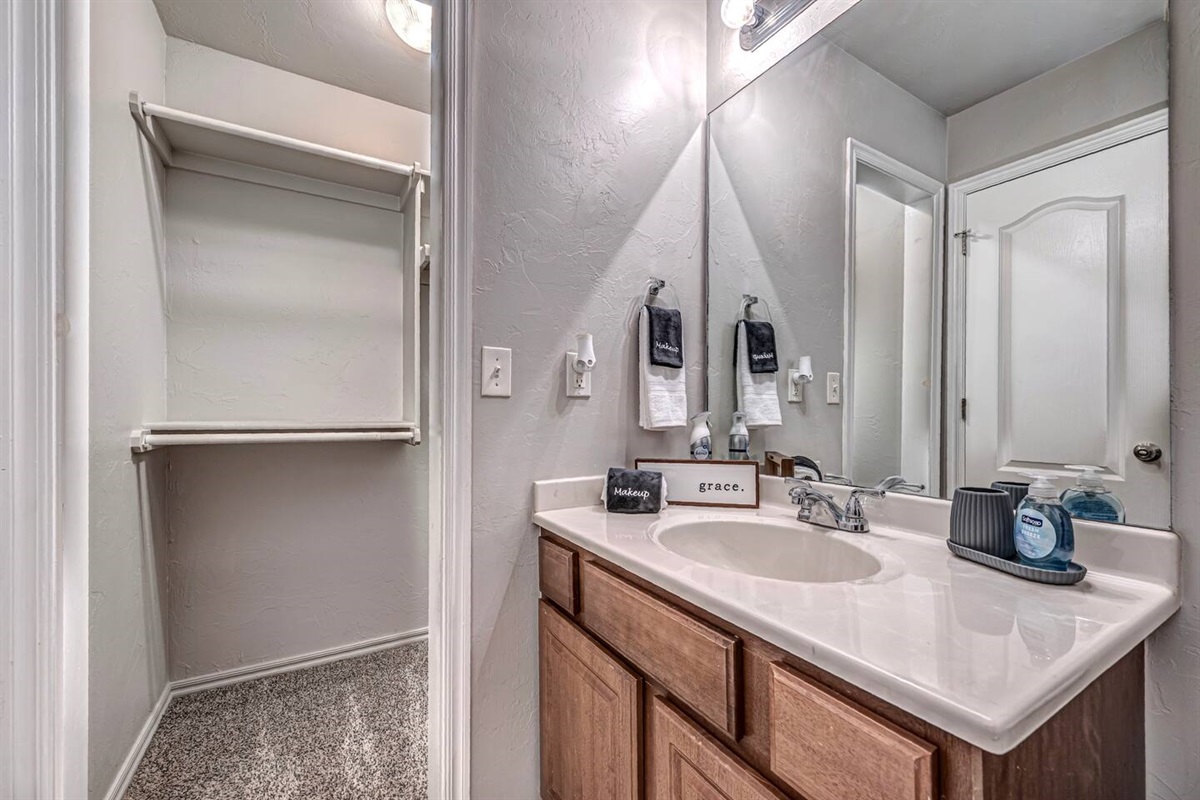 Fresh and clean Master bathroom featuring a walk-in closet and a shower/tub for your comfort.