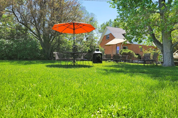 This outdoor wonderland is between the house and the lake.  For dining: host the ultimate picnic. 2 wrought iron patio tables with umbrellas, a propane grill, and a fire pit. Relax, unwind, and bring loved ones together in colorful Colorado.