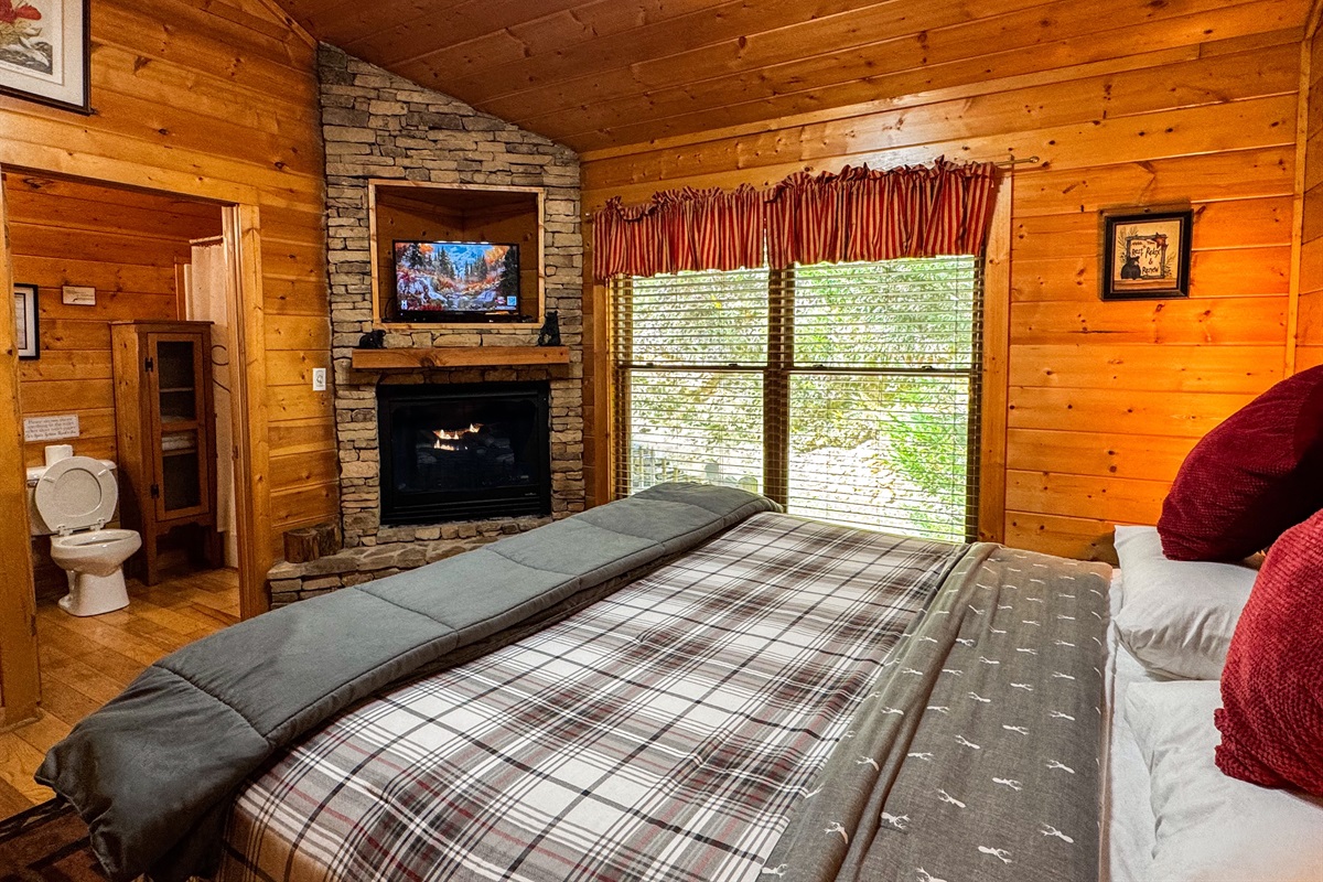 King bed, TV, and a fireplace in the master bedroom!
