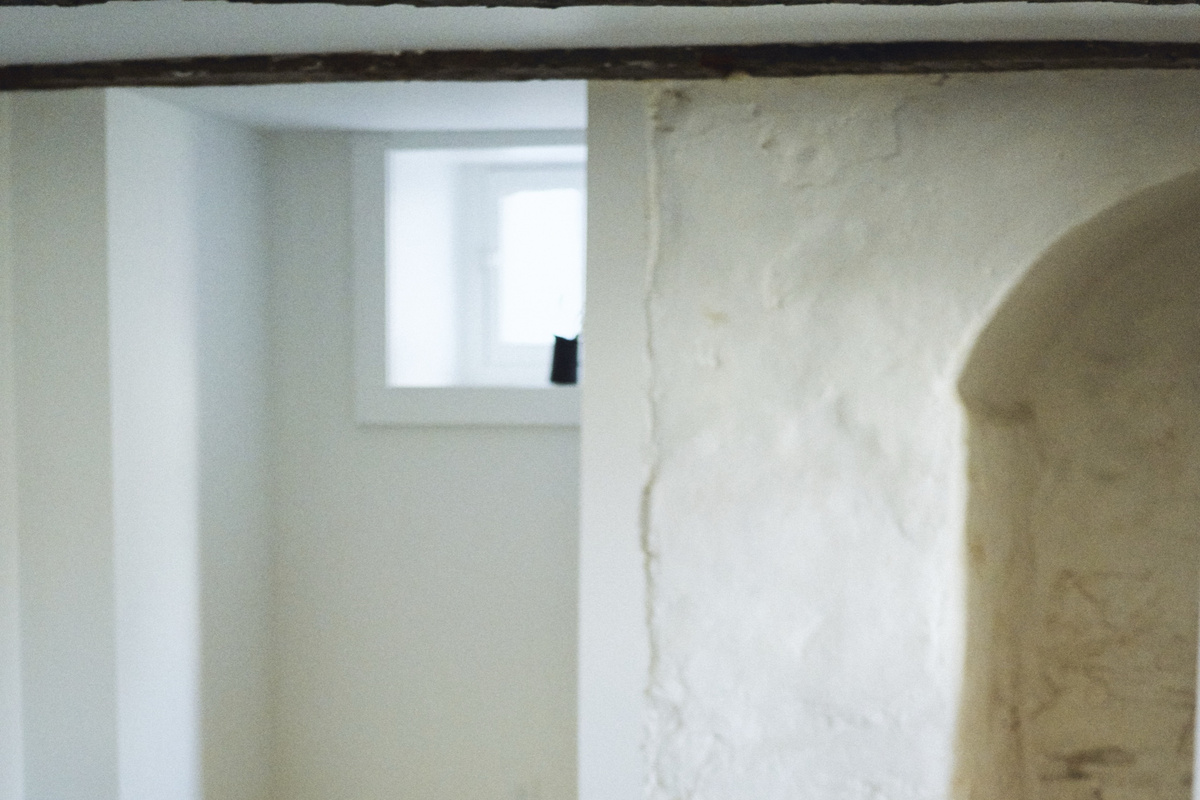 Whitewashed stone walls in the bedroom