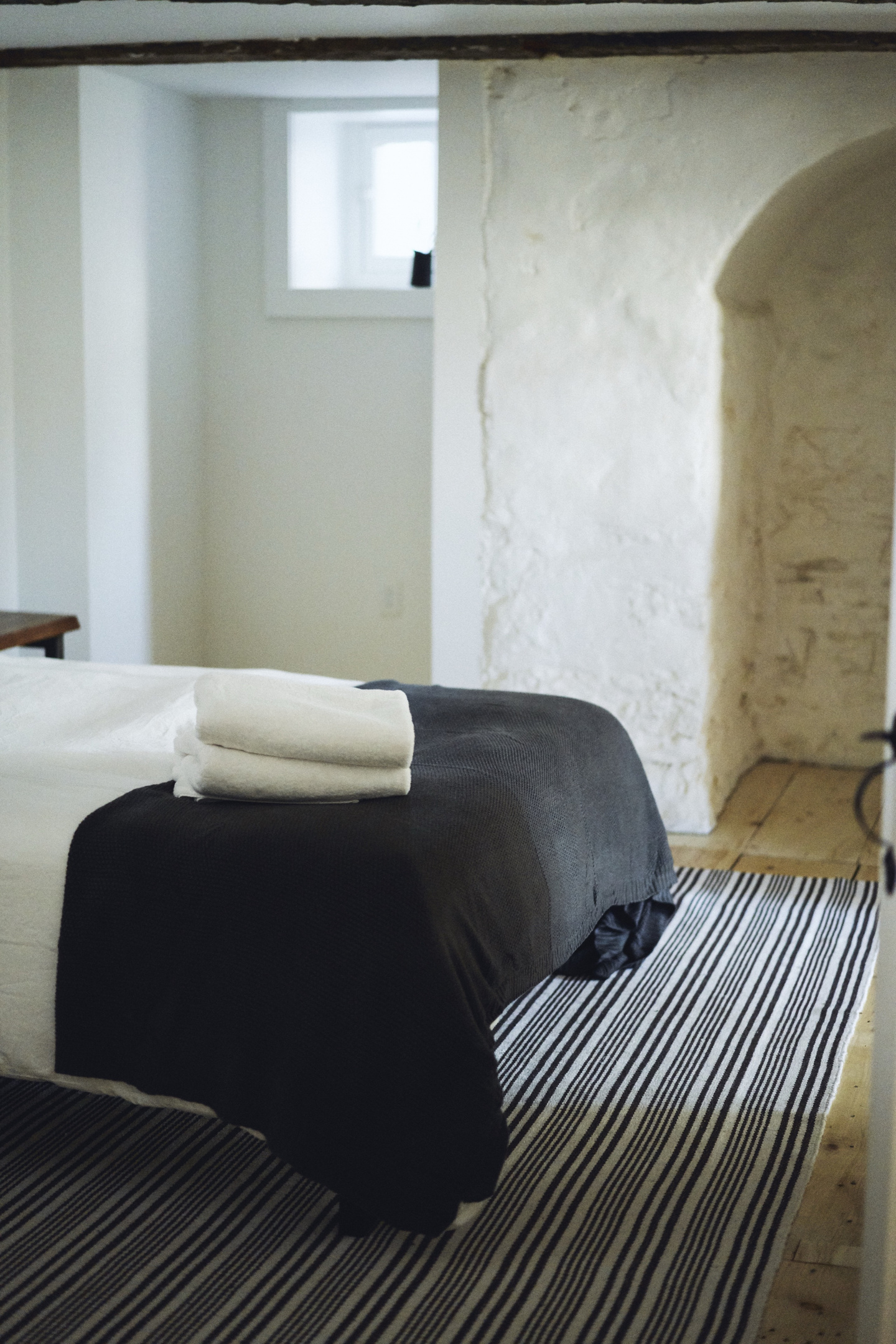 Whitewashed stone walls in the bedroom