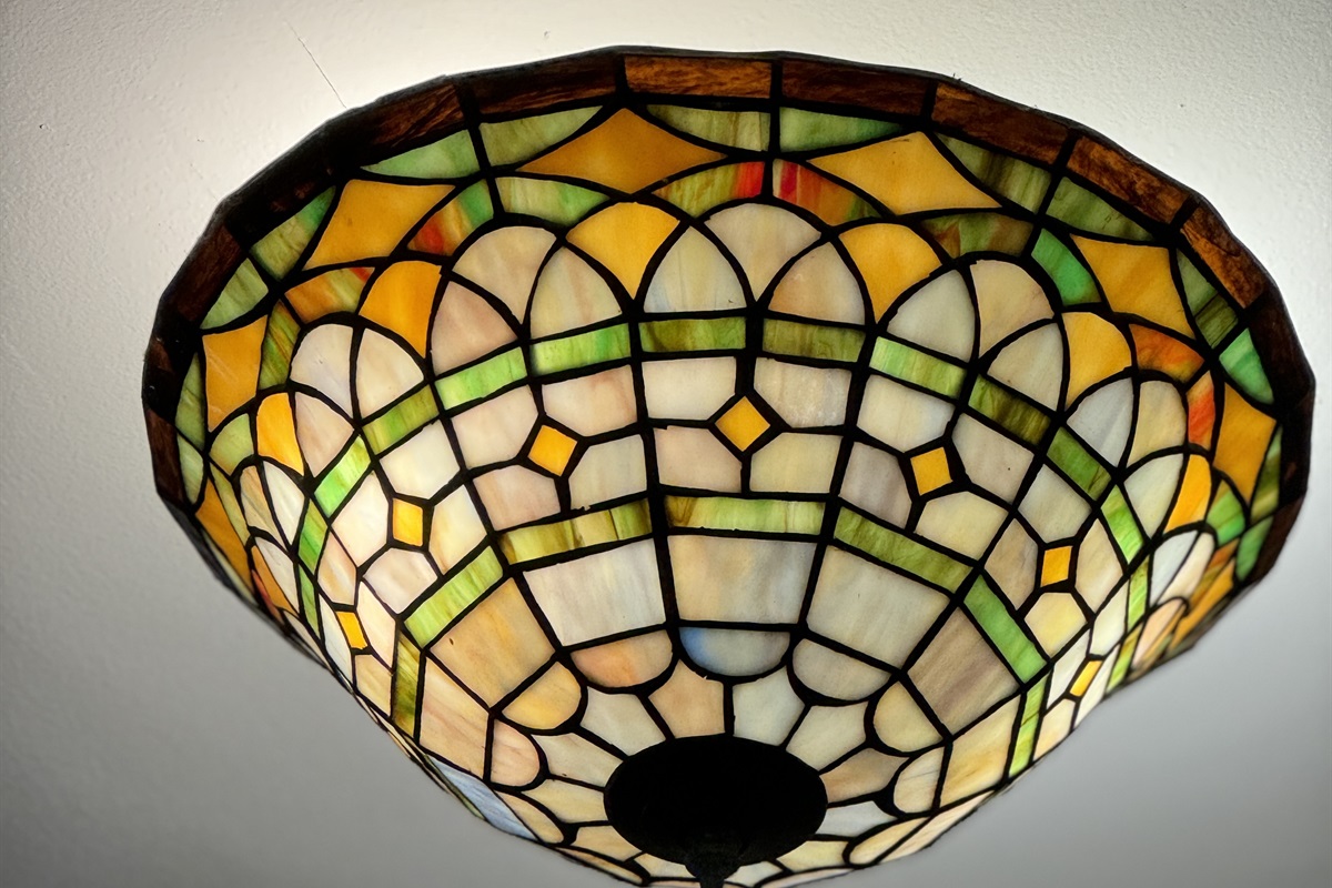 Tiffany-style ceiling light in center hallway