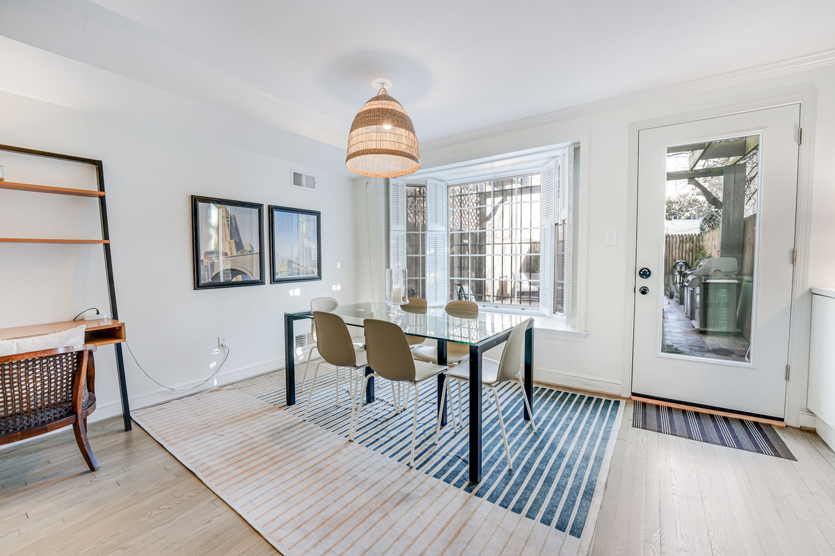 Dining Room: Seating for 6, Desk, Rear Door to Patio, Free Parking, EV Charging.
