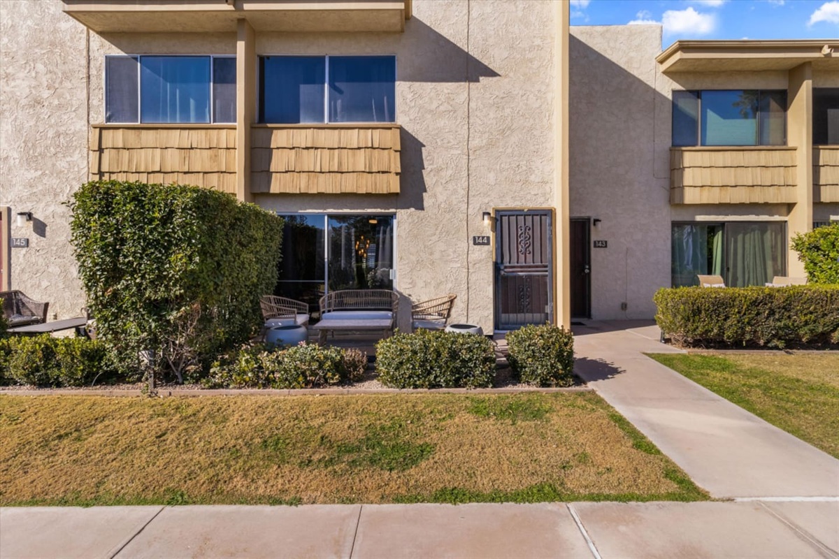 Front patio with outdoor seating, a small table, and easy access to the property
