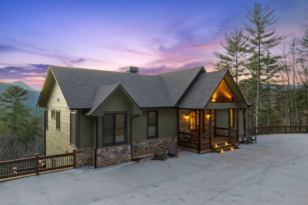 A welcoming front view of the chalet, complete with ample parking and a charming entrance.