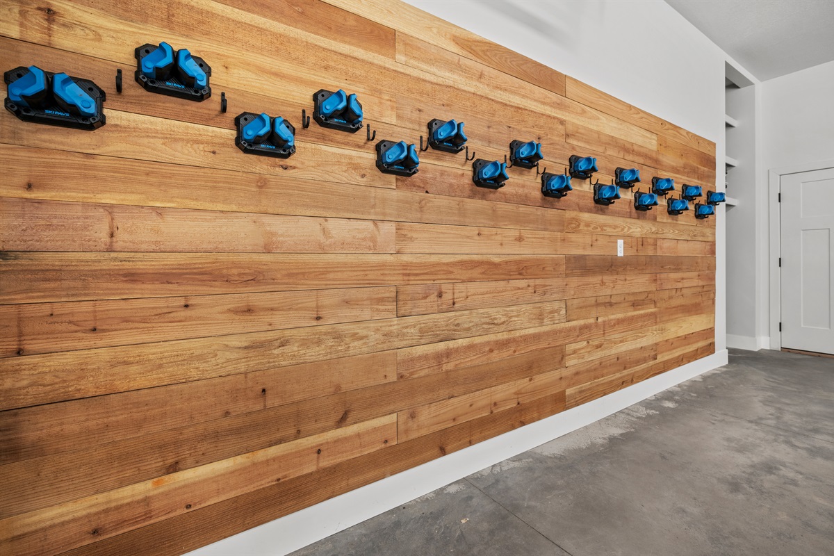 two-car garage features storage for 10–12 skis or snowboards plus a private tuning station to keep your gear in top shape